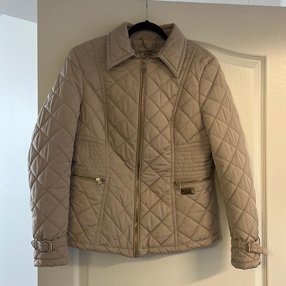 I'm selling a Burberry  jacket in excellent condition, size 10 beige color